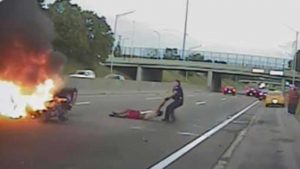Michigan police officer rescues man from fiery car crash